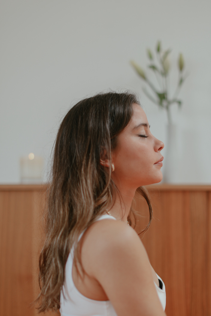 Side View of a Woman in White Tank Top